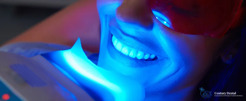 CD - Woman undergoing a teeth whitening procedure