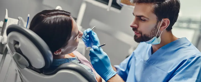 CD-dentist cleaning woman's teeth