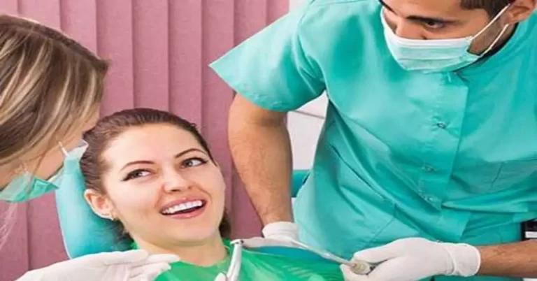 A patient talking to two dentists